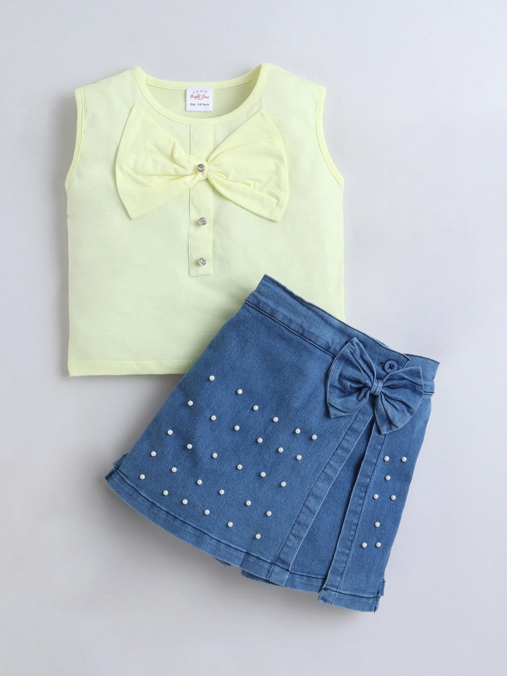 Bright Stars KIDSWEAR Cotton Single Jersey Sleeveless Top With Bow And Denim Pearl Embellished Skorts Set - Yellow